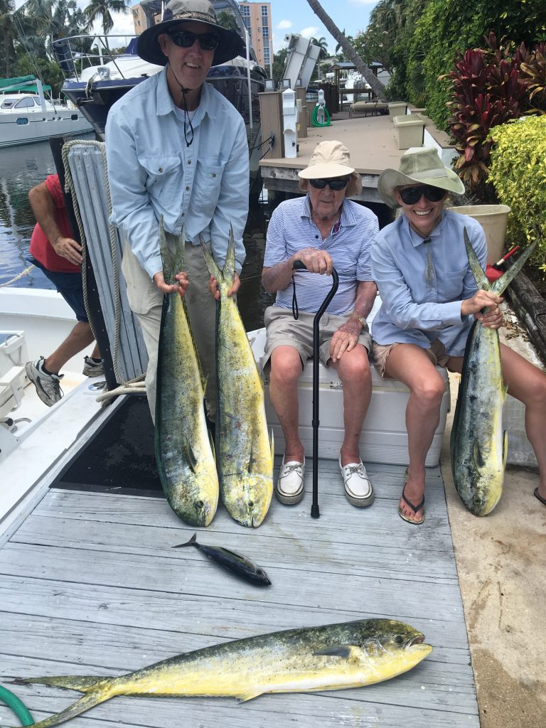 Jack, John and Rachel posing with their dolphin trip out of Lauderdale