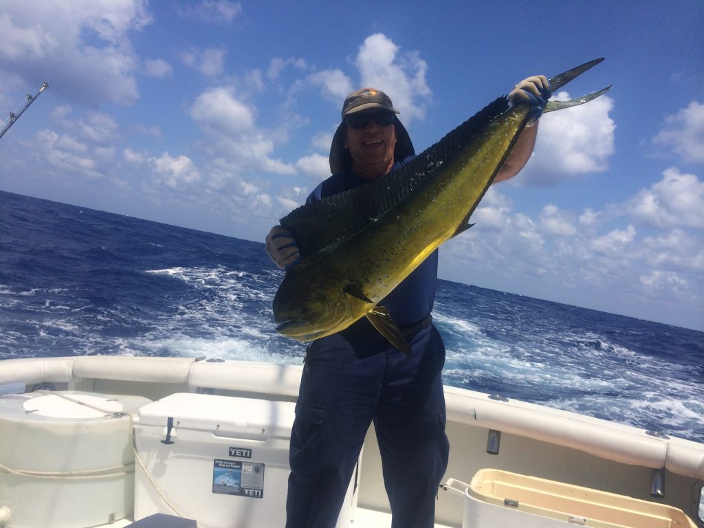 Capt. Chuck holding a nice dolphin