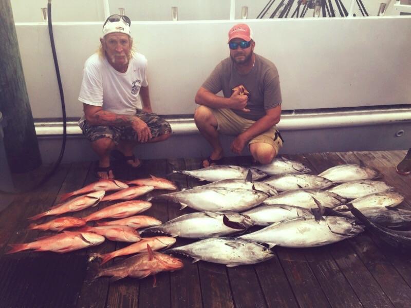 Kunta and Butch with a nice catch of snappers and bonitos at the dock in Ft Lauderdale