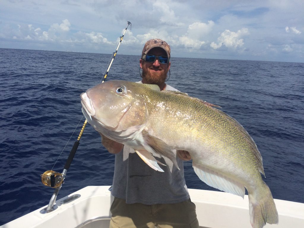 Capt. Adam holding a 40+ pound golden tilefish.