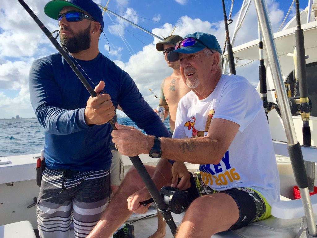 Sailfish on the line, angler in the chair