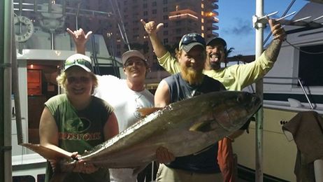 Some ecstatic anglers with a huge amberjack