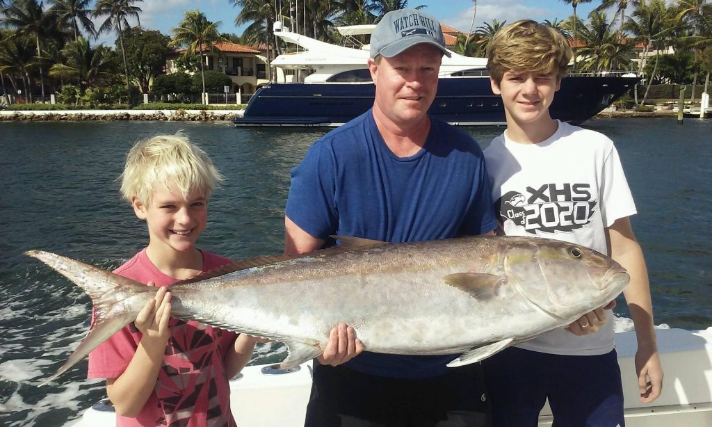 Nice amberjack being held up by the anglers heading back in from fishing in the Ft Lauderdale Intracoastal Waterway