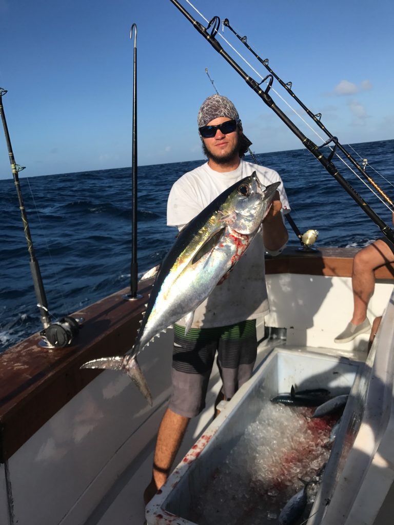 Matt holding a nice blackfin tuna just caught trolling.