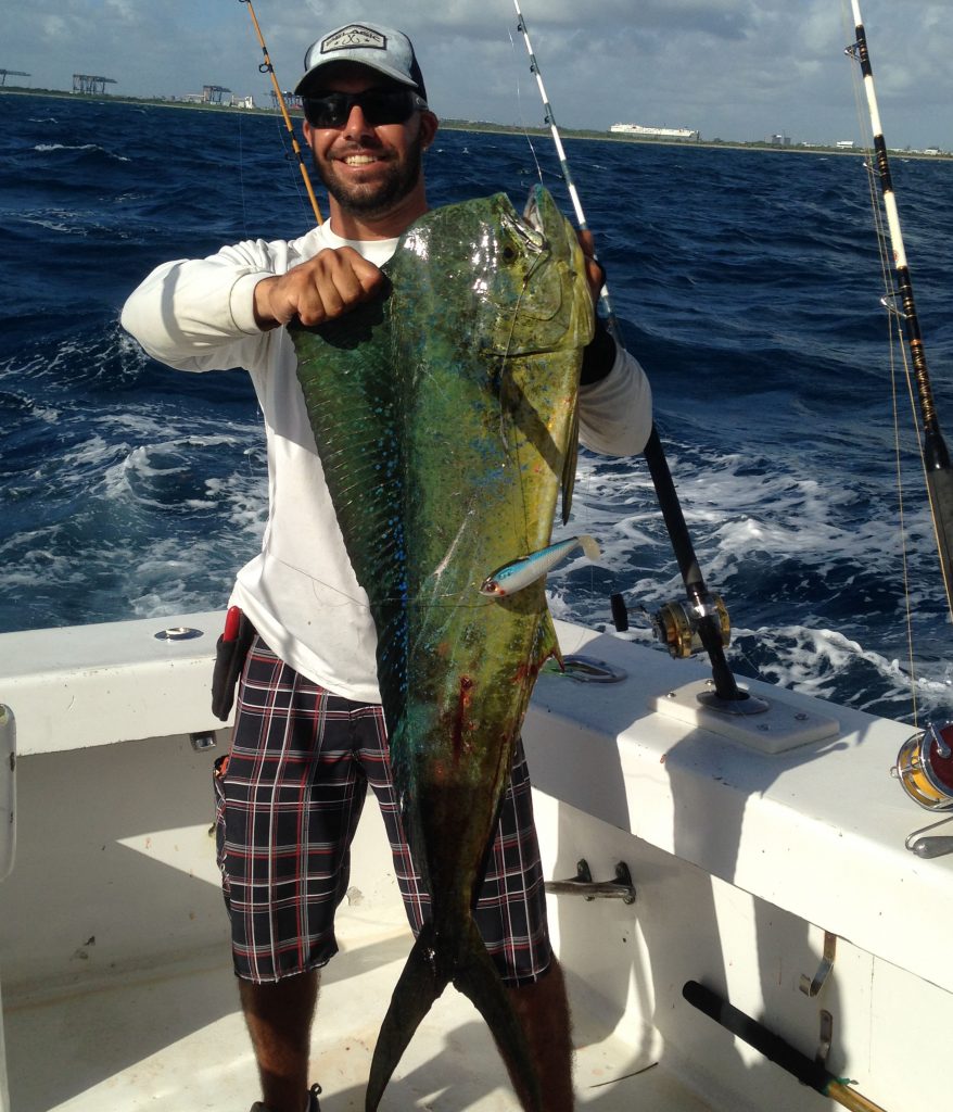 Bobby holding a nice dolphin freshly caught on our sportfish charter.