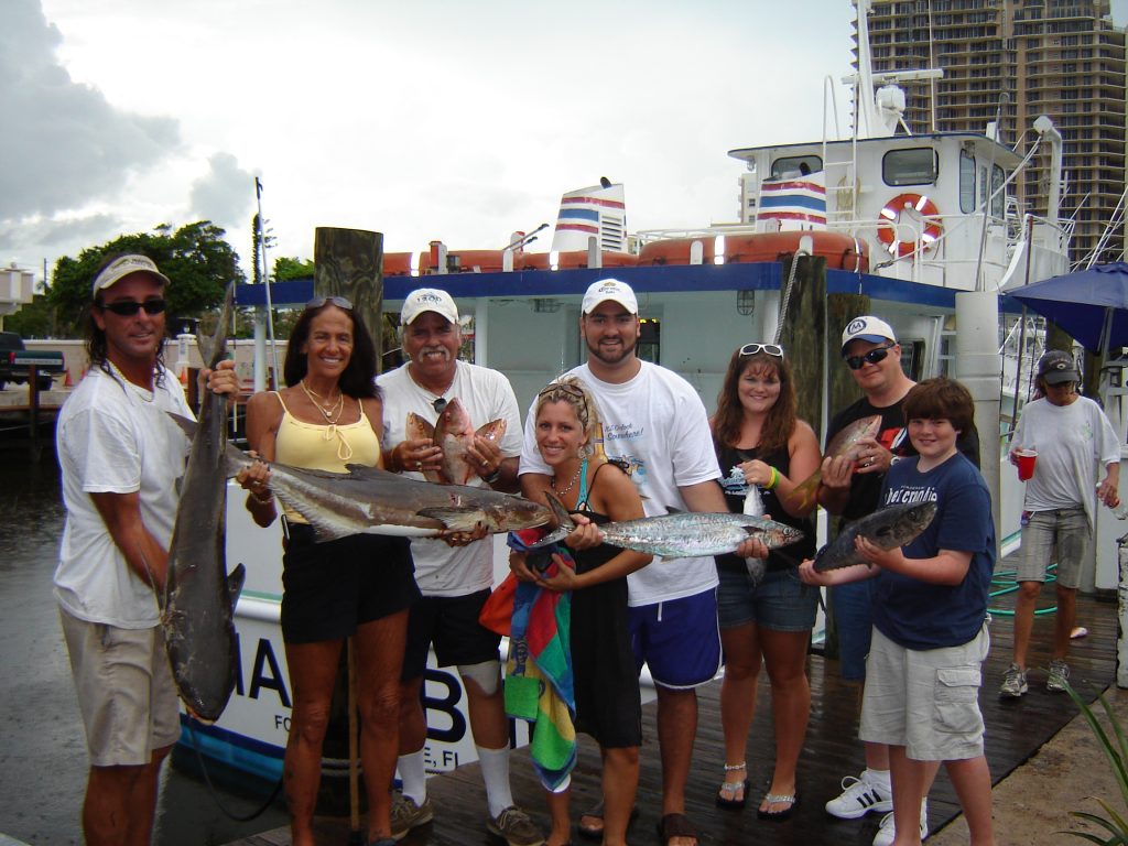 Nice family posing with their catch after their fishing trip. Some nice fish are biting in Fort Lauderdale.