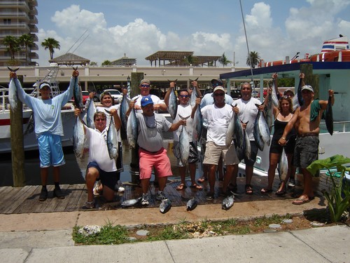 Some proud fishermen holding their catch after their drift fishing trip in Fort Lauderdale.