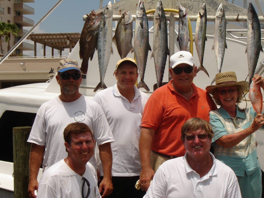 Ft Lauderdale deep sea fishing charter catch and crew standing for a picture.