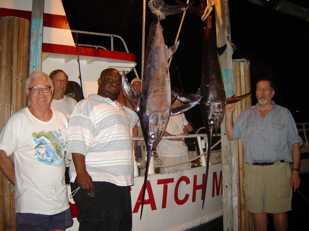 Back at the dock with the swordfish we caught on our night swordfishing charter