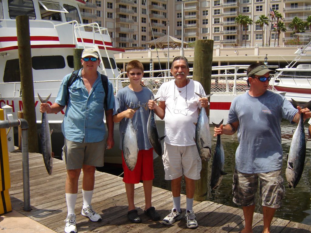 These guys holding up their catch from a drift boat trip