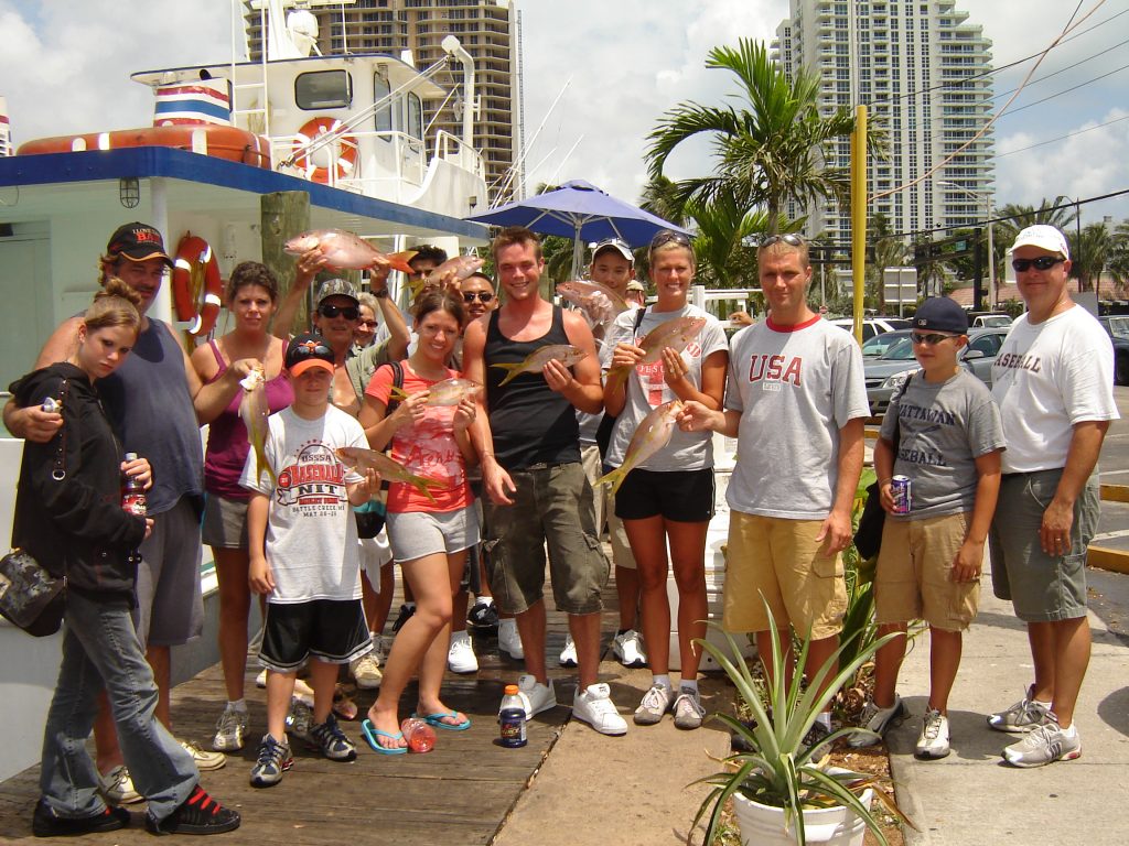 This group poses with a bunch of snappers