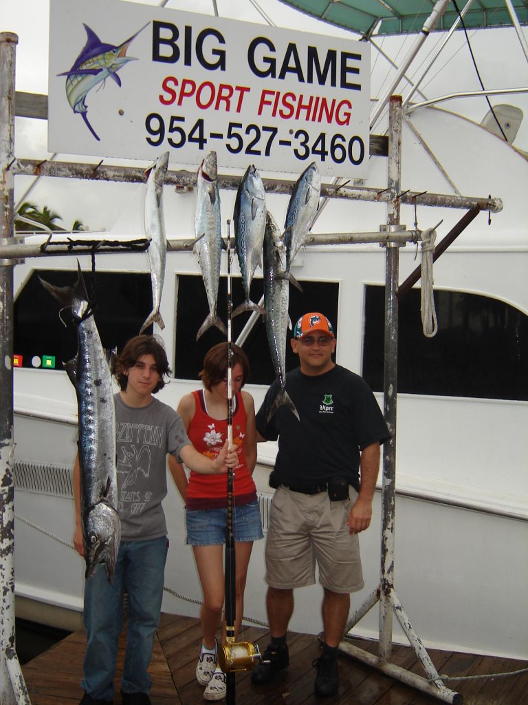 Family posing with their catch at the dock in Fort Lauderdale