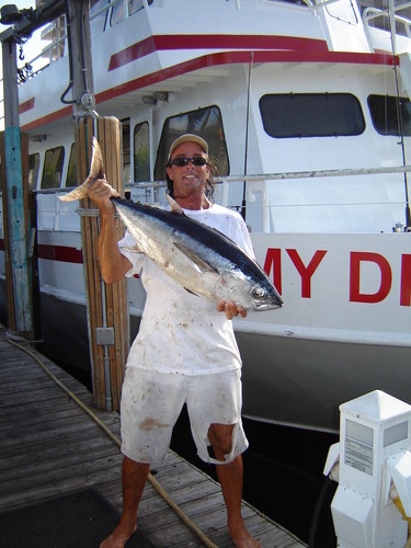 Kevin holding a nice tuna caught drift fishing