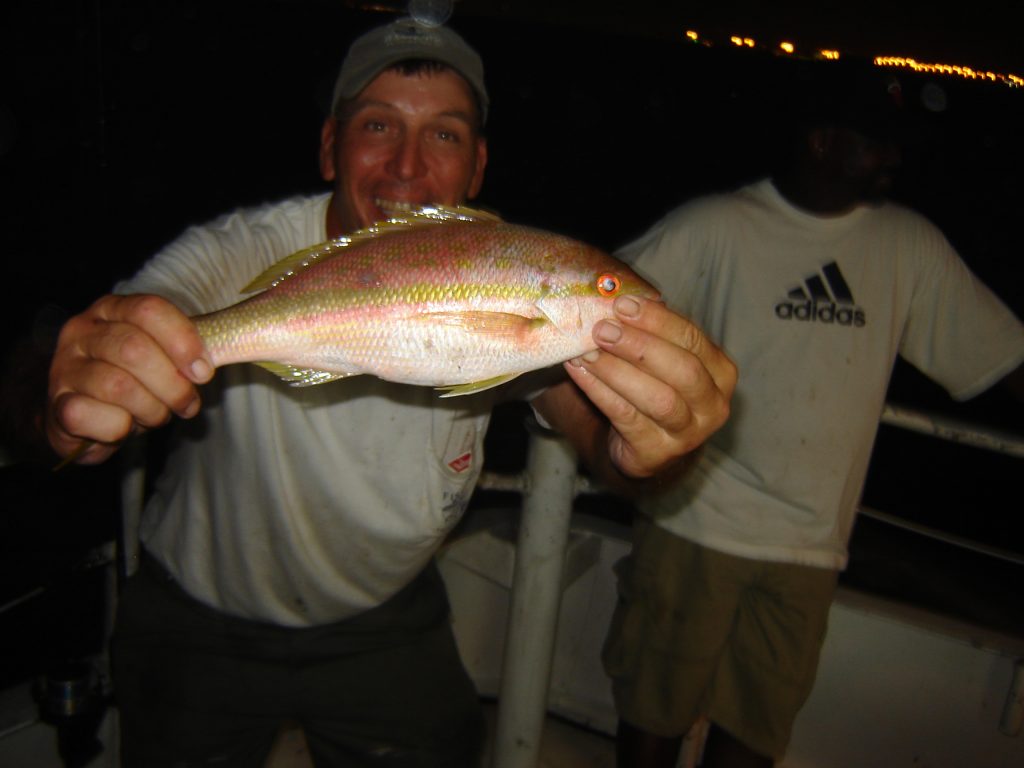 Crazy Capt Chuck with a yellowtail snapper he just caught