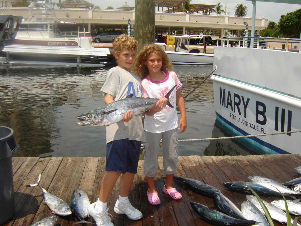 Couple of cute kids fishing on our drift boat