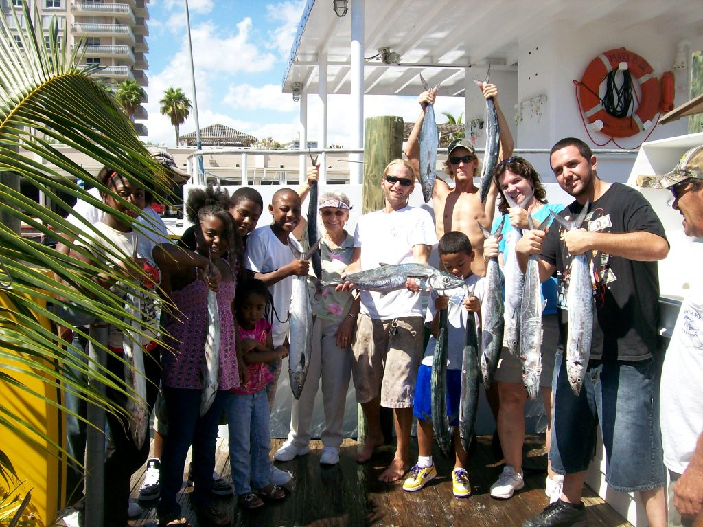 Group posing with their drift fishing catch