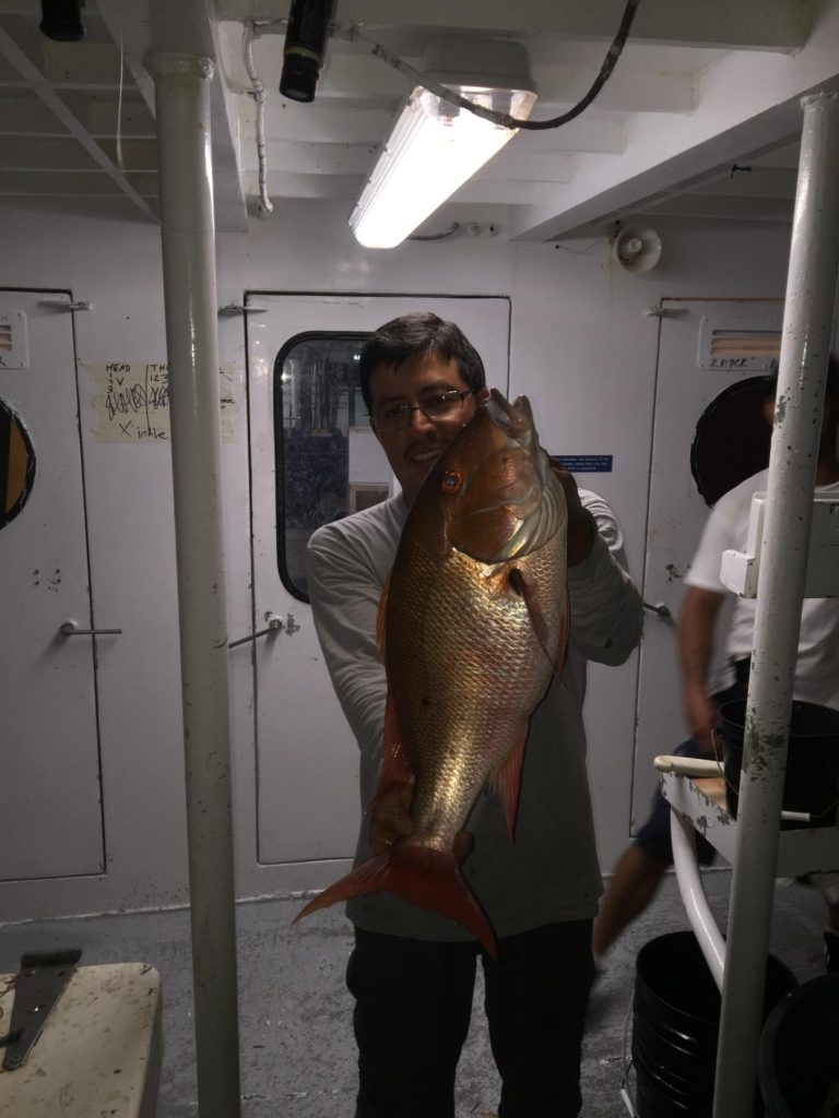 Guy holding a nice mutton just caught night anchor fishing in Ft Lauderdale