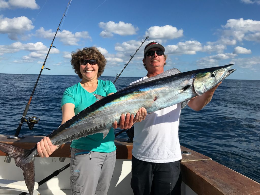 Rod and Linda holding a wahoo just caught.