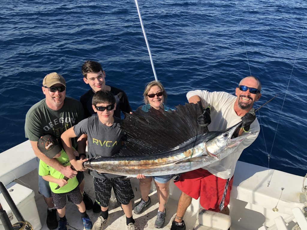 Family posing with a nice sailfish caught in Ft Lauderdale.