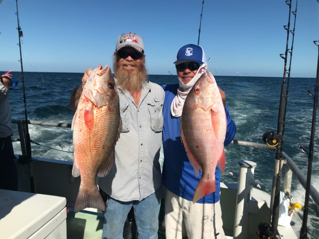 John and Johnny holding a nice pair of snappers caught on our drift fishing trip