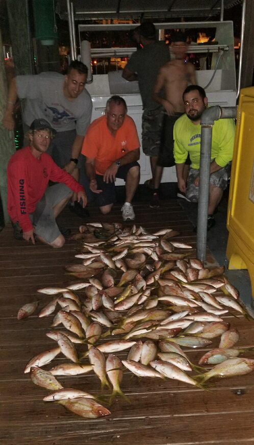 Nice pile of yellowtail snappers on the dock after a night trip aboard the Catch My Drift.